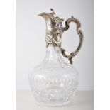 Cut glass claret jug, with Continental silver mounts, rococo style, stamped 925, 26cm.