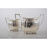 Silver three piece teaset, shaped oval form, on paw feet, C.B. & S.