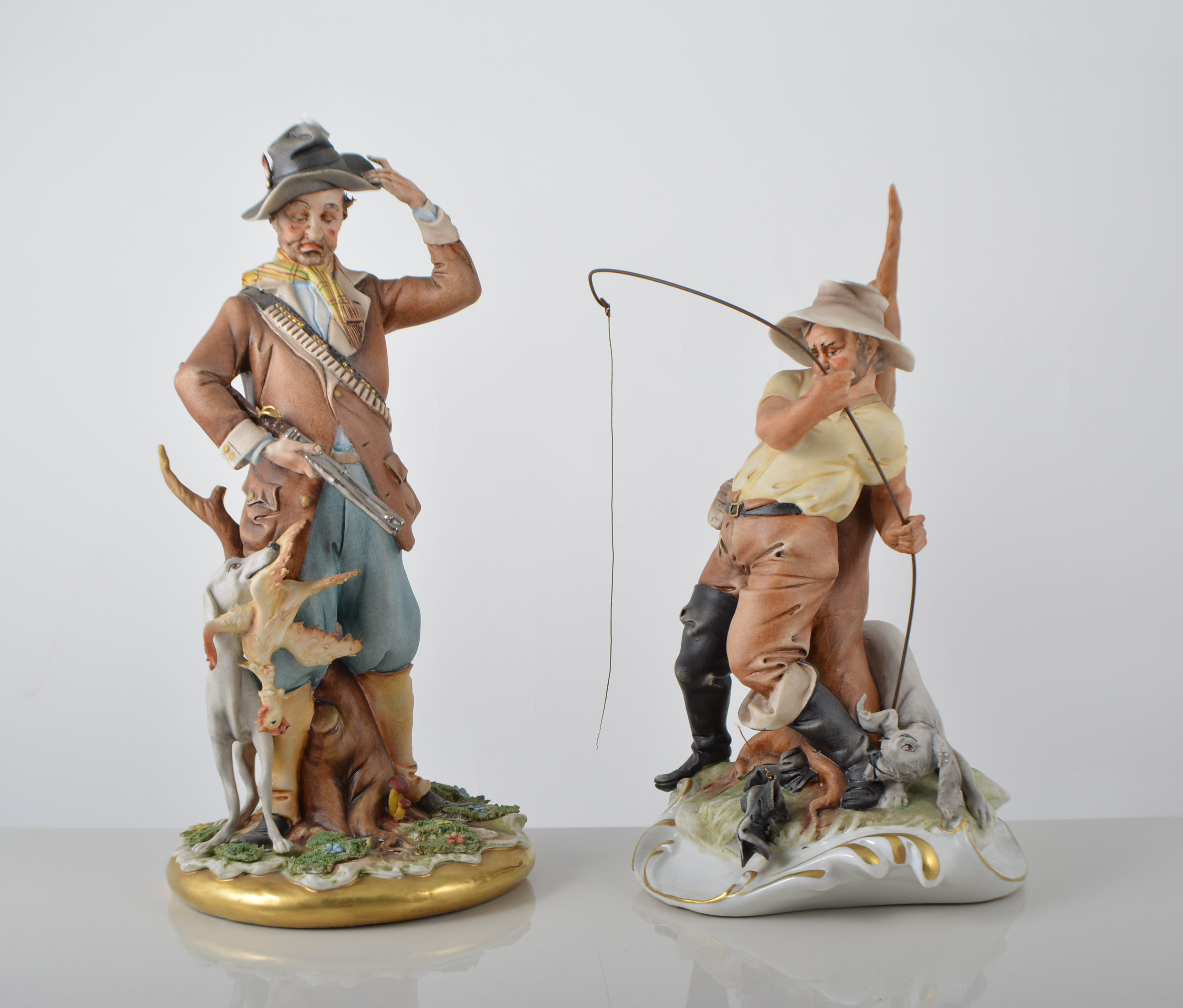 Two Capodimonte figures, including Fisherman No. 239 and Hunter No.