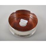 Modern silver coaster, mahogany base, diameter 10cms, boxed, plus two silver mounted dishes,