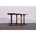 Nest of three modern oak occasional tables, rectangular tops, turned columns, width 56cms,