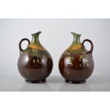 Two Doulton Burslem Kingsway golfing jugs, by Charles Noke, printed factory marks,