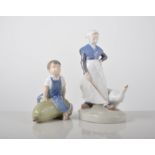 Two Royal Copenhagen figures, a boy seated on a marrow 4539, and a girl with goose 528,