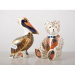 Royal Crown Derby "Brown Pelican" paperweight and a seated teddy paperweight both silver plugs,