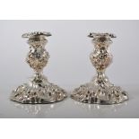 Pair of silver repousee chased silver candlesticks, Sheffield 1898, 12cm.