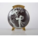 Moore pottery moon flask, with pate sur pate decoration of cherubs picking fruit, incised to body H.