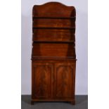 Mahogany bookcase, open fixed waterfall shelves to the upper section,