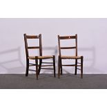 Pair of Edwardian child's' chairs, stained beechwood frames, rush seats, width 35cms, height 64cms.