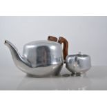 Silver plated tray, circular form, cast scrolled border and feet, diameter 32cm, Picquot tea set,