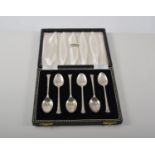Two cased sets of hallmarked silver teaspoons and two boxed sets of dessert knives,