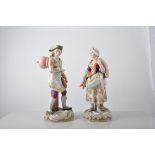 Pair of Continental porcelain figures, lady and gentleman in 18th Century dress,