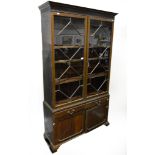 Reproduction mahogany bookcase, in the Georgian style, blind fretwork frieze,