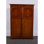 Edwardian mahogany wardrobe, moulded and cavetto cornice, inlaid doors enclosing a hanging rail,