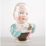 Continental porcelain bust of a Girl, painted in colours, incised No. 2744, height 24cm.
