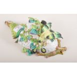 Continental porcelain wall pocket, designed as a birds nest, applied bird and flowers,