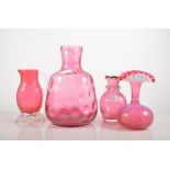 Cranberry glass vase, height 19cm, four cranberry glass bowls,