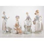 Lladro porcelain model, Boy with a Dog, height 20cm and three other Lladro figure and animal groups,