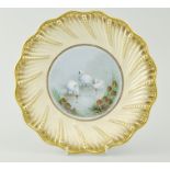 Coalport cream ground and wrythen moulded cabinet plate, painted with swans by Malcolm Harnett,