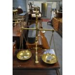 Set of brass pedestal scales, by Doyle & Son, London, approximate height 59cm.