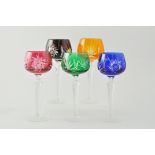 Eight Victorian style ruby tinted wine glasses, height 13cm, five coloured glass hot glasses,