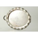 Silver plated tray, oval form, twin handles and cast scrolled border, length 58cm.