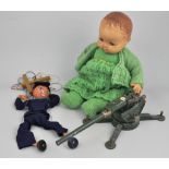 Saturn TV Robot, a model field gun, Pelham puppet, two Rosebud dolls,