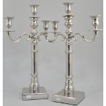 Pair of nickel plated table candelabra, each with three sconces and two scrolled branches,