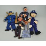 Two Pelham "Policeman" puppets and three other glove puppets, (5).