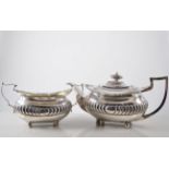 George III silver three piece tea set, cushion shaped form with gadroon fluted band around centre,