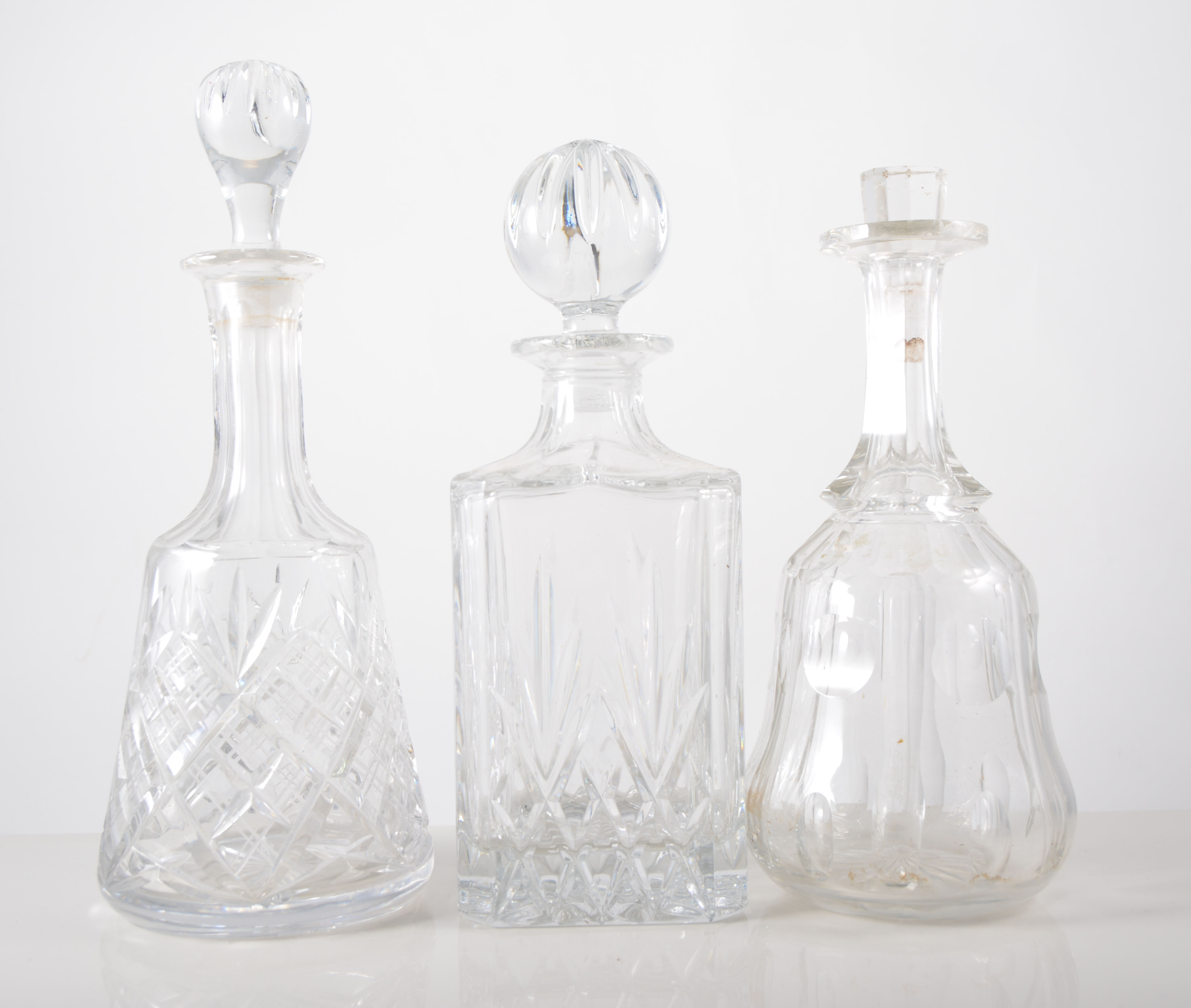 Pair of Edwardian cut glass decanters, 25cm, six other decanters and three Champagne glasses, (11).