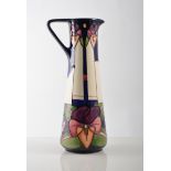 Moorcroft vase in a stylised Pansy design of a slender tapered form, 24cm, 2006, second quality.