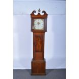Oak longcase clock, the hood with a swan neck pediment, turned and fluted columns,