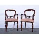 Pair of Victorian style mahogany balloon back elbow chairs, carved rails, scrolled arms,