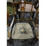Edwardian stained beech and inlaid elbow chair, arched back, slat with a fan oval, needlework seat,