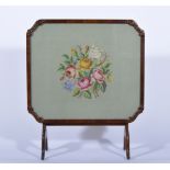 Stained walnut metamorphic table fire screen, floral needlework inset, splayed legs,
