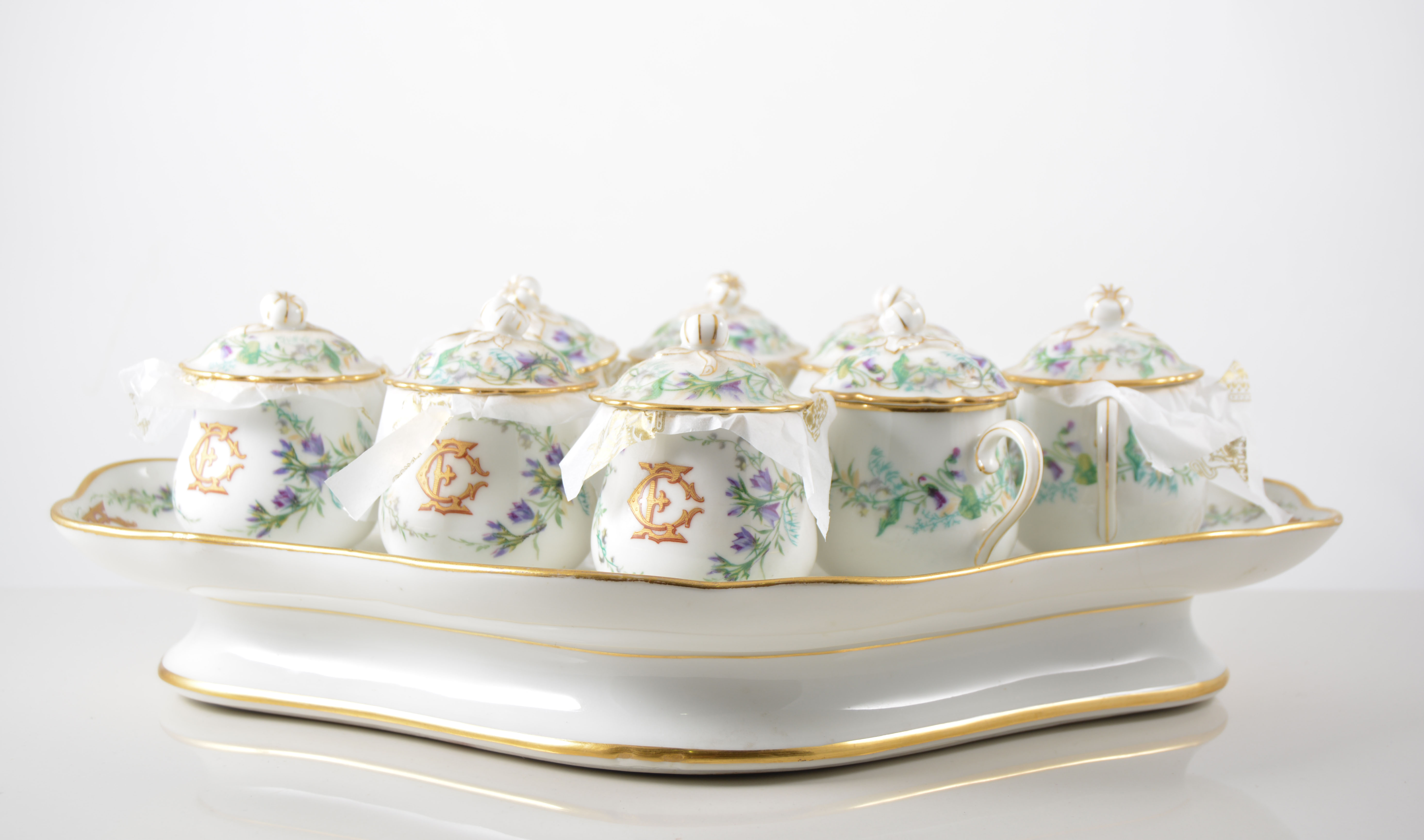 Two Continental porcelain cabaret sets each having eight lidded chocolate cups,