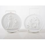 Pair of Royal Copenhagen Parian plaquettes, after Thorveldsen, decorated with angels and cherubs,