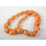 Amber egg bead shape necklace, 27 beads graduating from 10mm x 7mm to 28mm x 13.