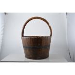 Coopered peat bucket, looped handle, height 42cm.