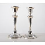 Pair of silver table candlesticks, central tapered column on circular foot with reeded band,