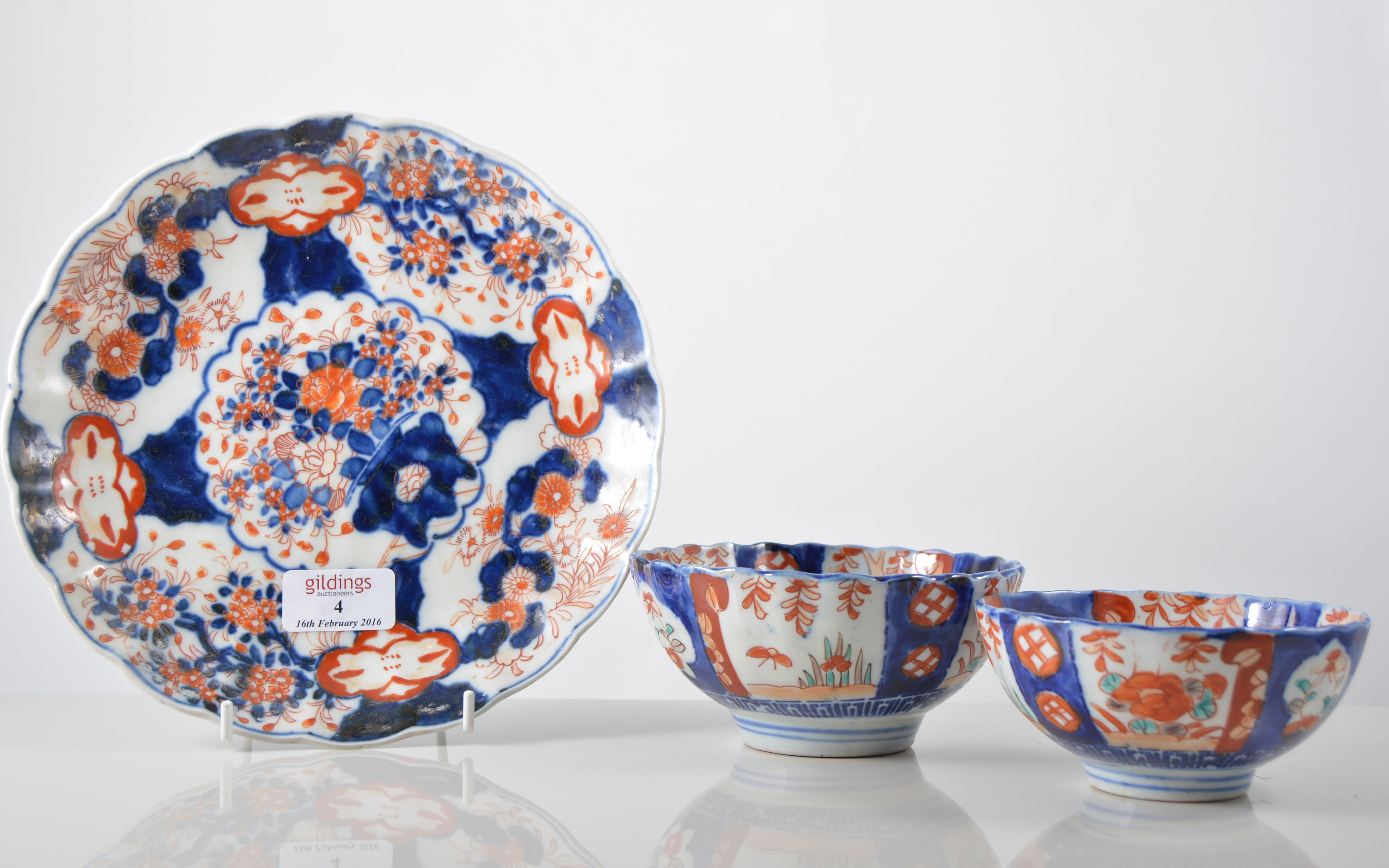 Japanese Imari bowl, lobed circular form, central vase with flowers and decorated panels,