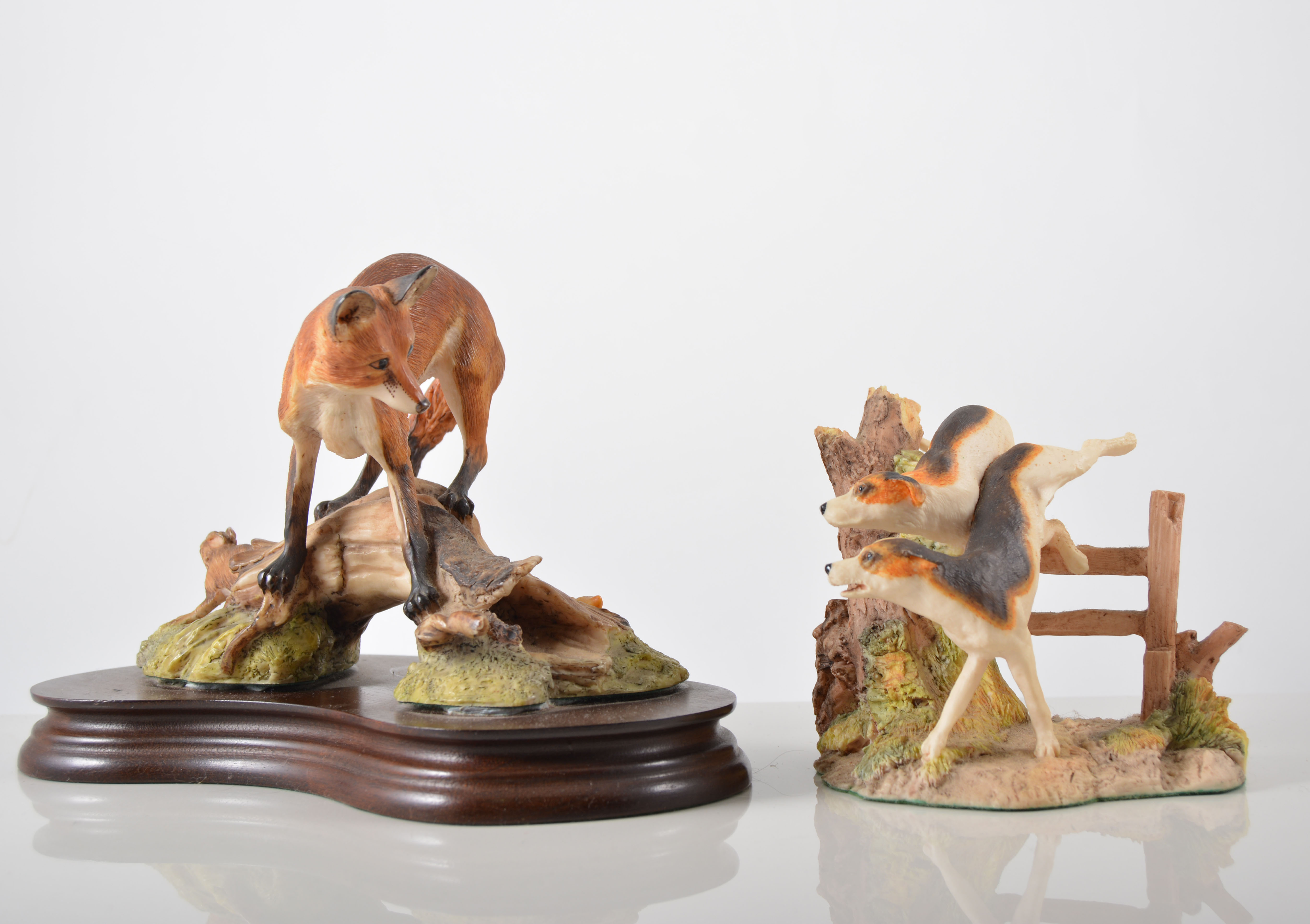 Beswick model of a fox, 14cm, three other Beswick foxes, an Aynsley model of a fox,