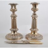 Pair of silver plated candlesticks, 22cms, another pair, 15cms, entree dish and cased flatware.