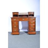 Victorian walnut desk, raised superstructure with spindle gallery, drawers and a shelf,