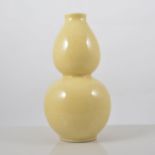 Chinese yellow ground double gourd shape vase, lightly incised decoration of foliage,