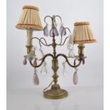 Pair of brass table lamps, each with acanthus scrolled branches and twin sconces, glass droplets,