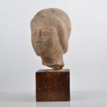 Carved marble portrait head, set on a square stained plinth, 30cms overall.