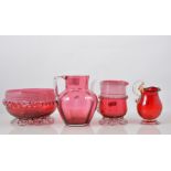 Cranberry glass jug and bowl, applied decoration and trailed banding, bowl diameter 15cms,