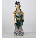 Chinese pottery figure of a woman with a serpent and bottle, decorated in lead colours, 37cms.