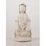 Chinese Blanc de Chine figure, of Guanyin with a child, 25cms.